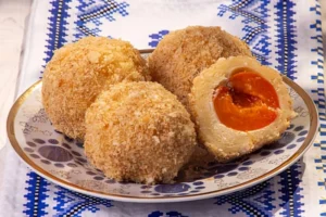 Traditional plum knedle dumplings with sweet fruit filling and crispy breadcrumb topping